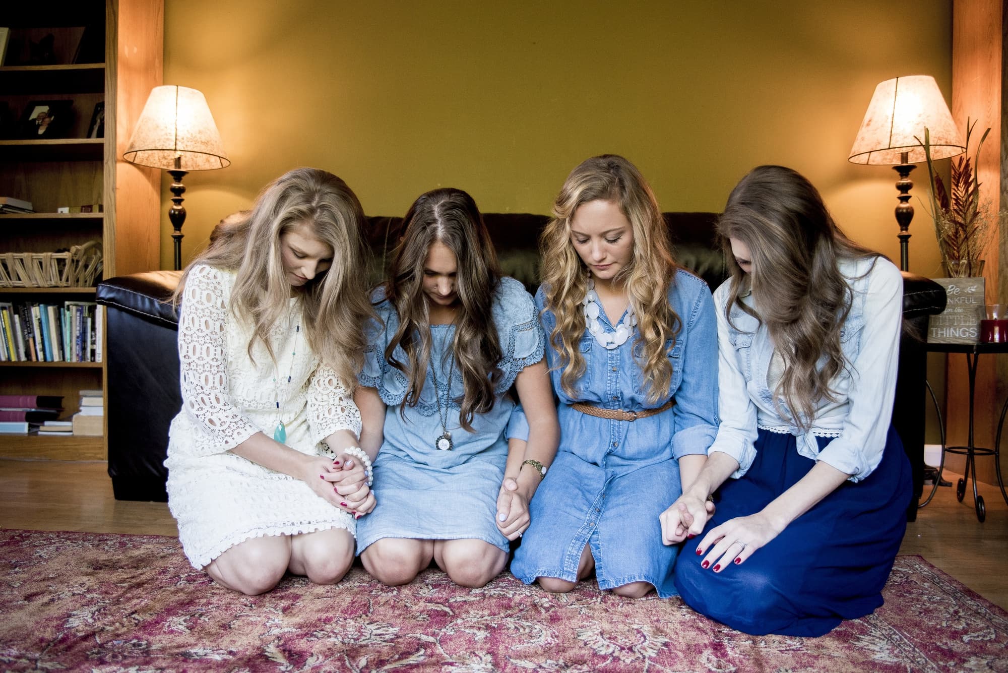 Women praying together in community